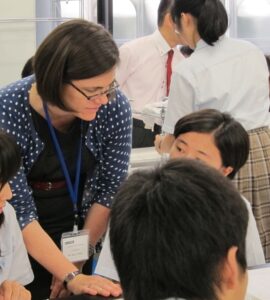 A teacher is working with several students
